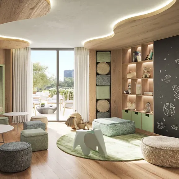Charming kids’ playroom with soft seating, natural wood finishes, and playful design elements bathed in natural light and warmth.