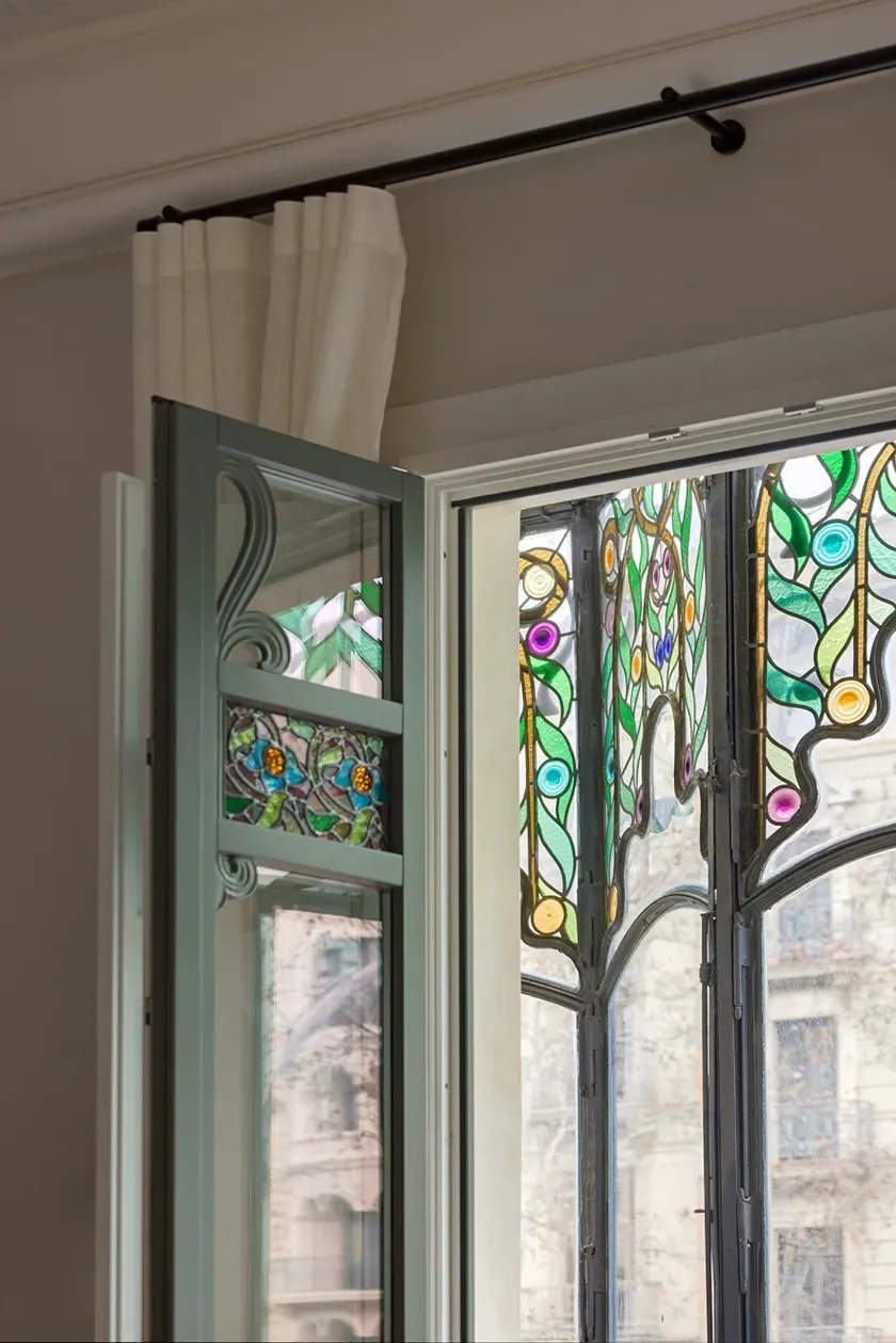 Colorful art nouveau stained glass details on windows, Barcelona design by LUV Studio.