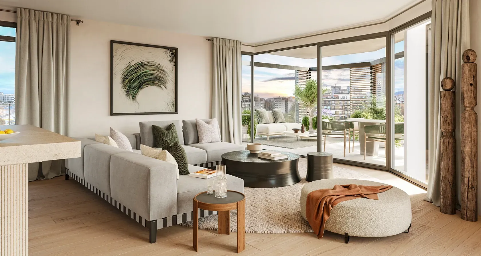 Spacious living room with curved sofa, warm accents and floor-to-ceiling windows leading to a lush terrace with views over Barcelona's skyline.