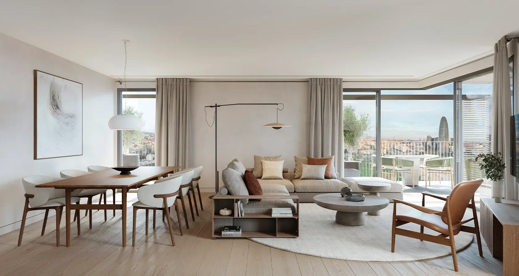 Refined open-plan living and dining room with minimalist furniture, warm textures, and panoramic terrace views including Torre Glòries in Barcelona.
