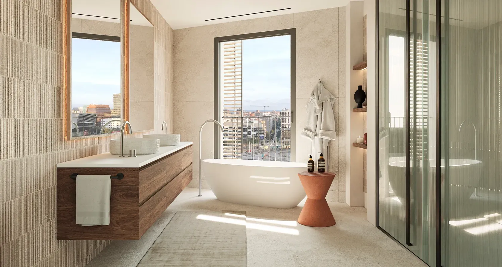Luxury bathroom with freestanding tub, textured stone finishes, wooden vanity, and large windows offering views over Barcelona.