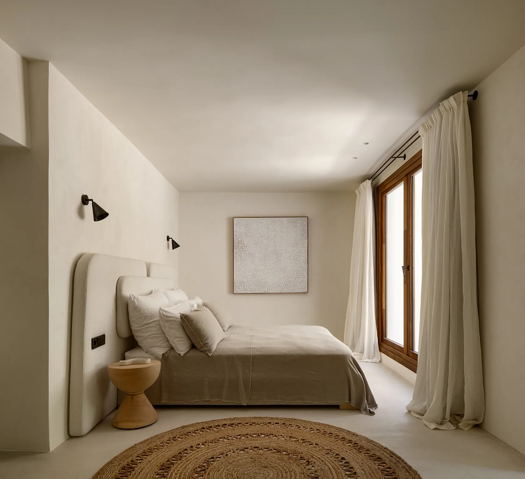 Minimalist bedroom with neutral tones, soft linens, natural textures, and sheer curtains enhancing the serene, luxury atmosphere.
