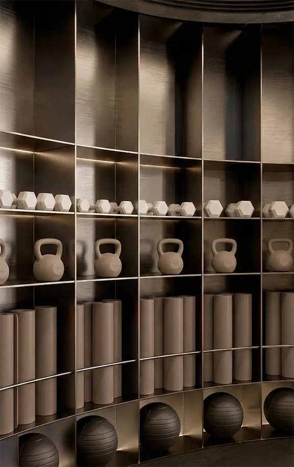 Wellness gym storage wall with integrated shelves, soft lighting and neutral training equipment